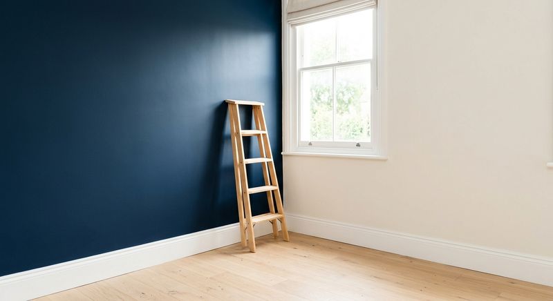 Freshly painted room with a deep navy accent wall and crisp white trim